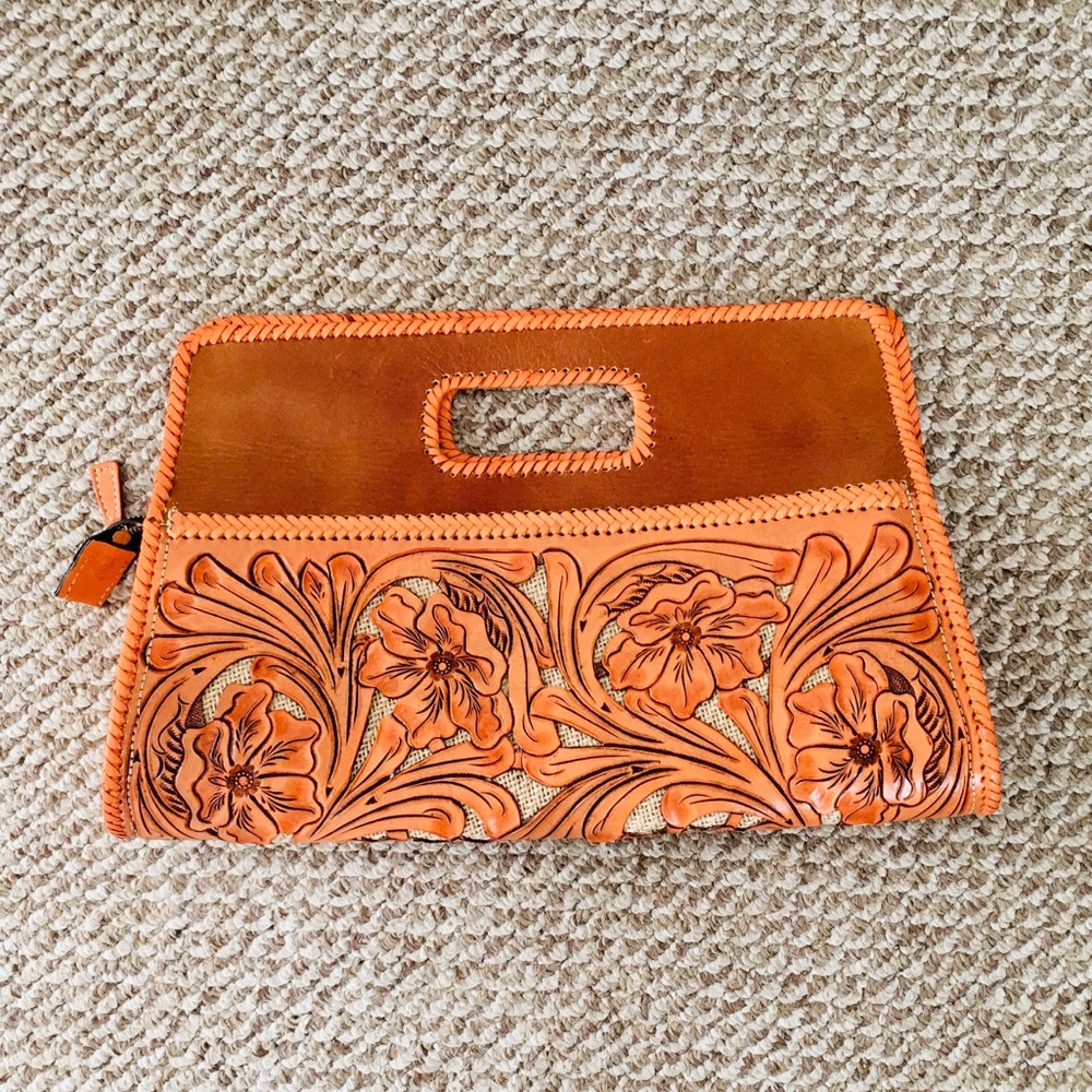 Oversized orange leather clutch